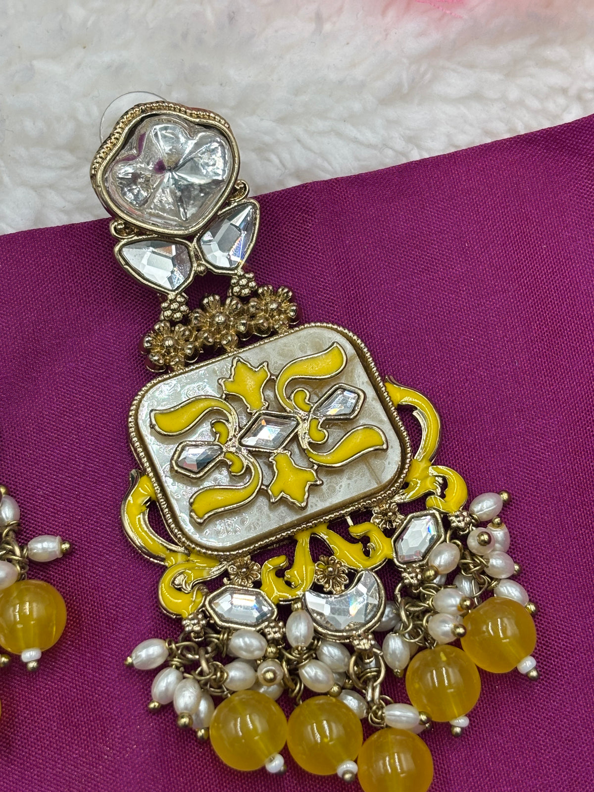 Elegant Kundan Earrings with Yellow Meenakari and Pearl Accents