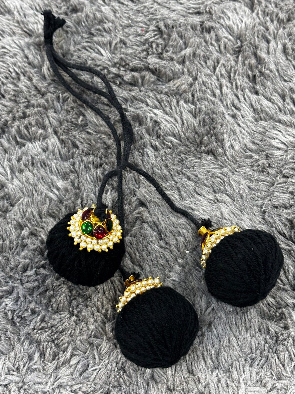Traditional Kemp Stone Ball Kunjalam for Bharatanatyam braid styling.