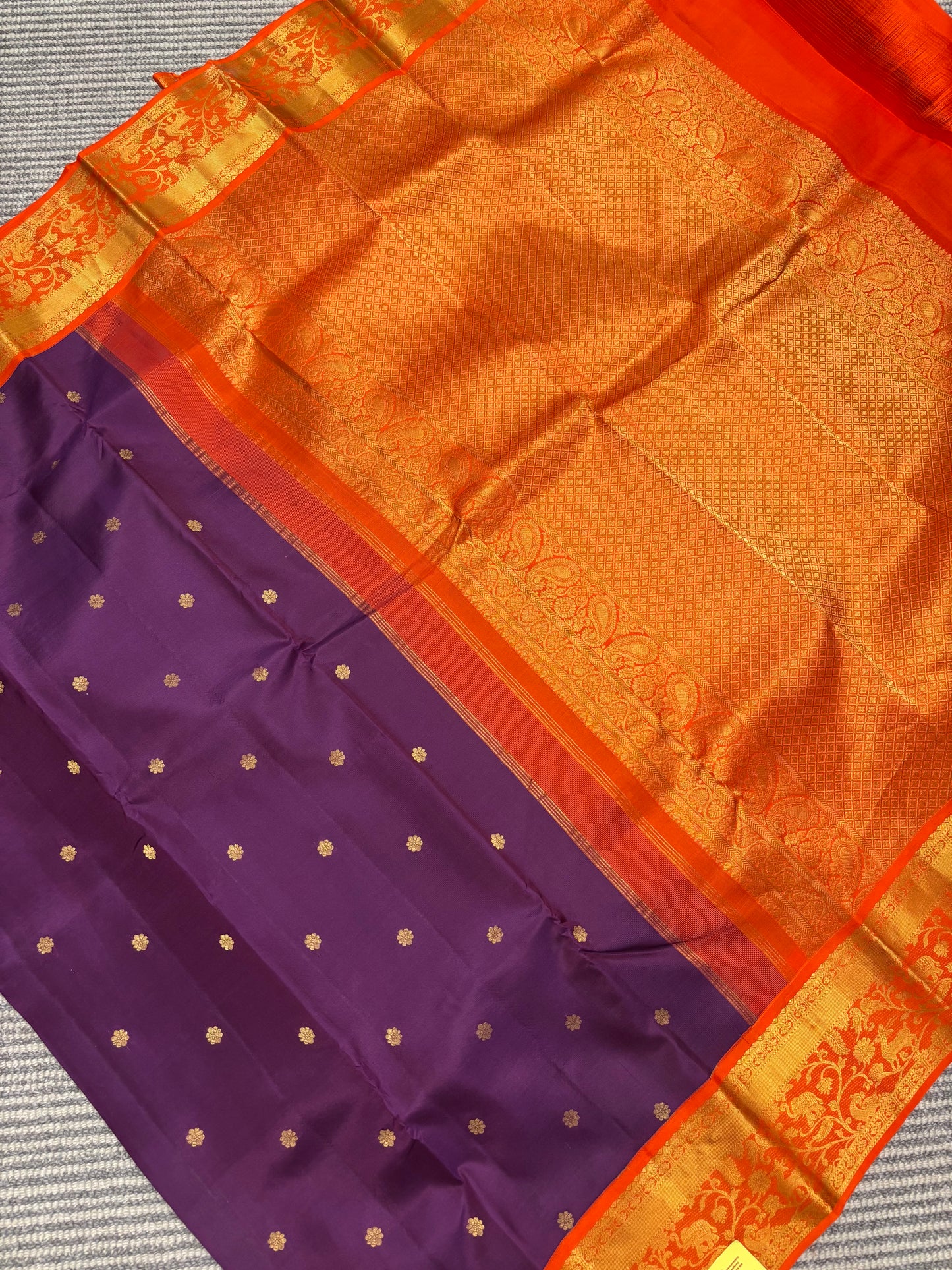 Elegant Purple Kanchipuram Silk Saree Featuring Orange Contrast and Floral Buttas
