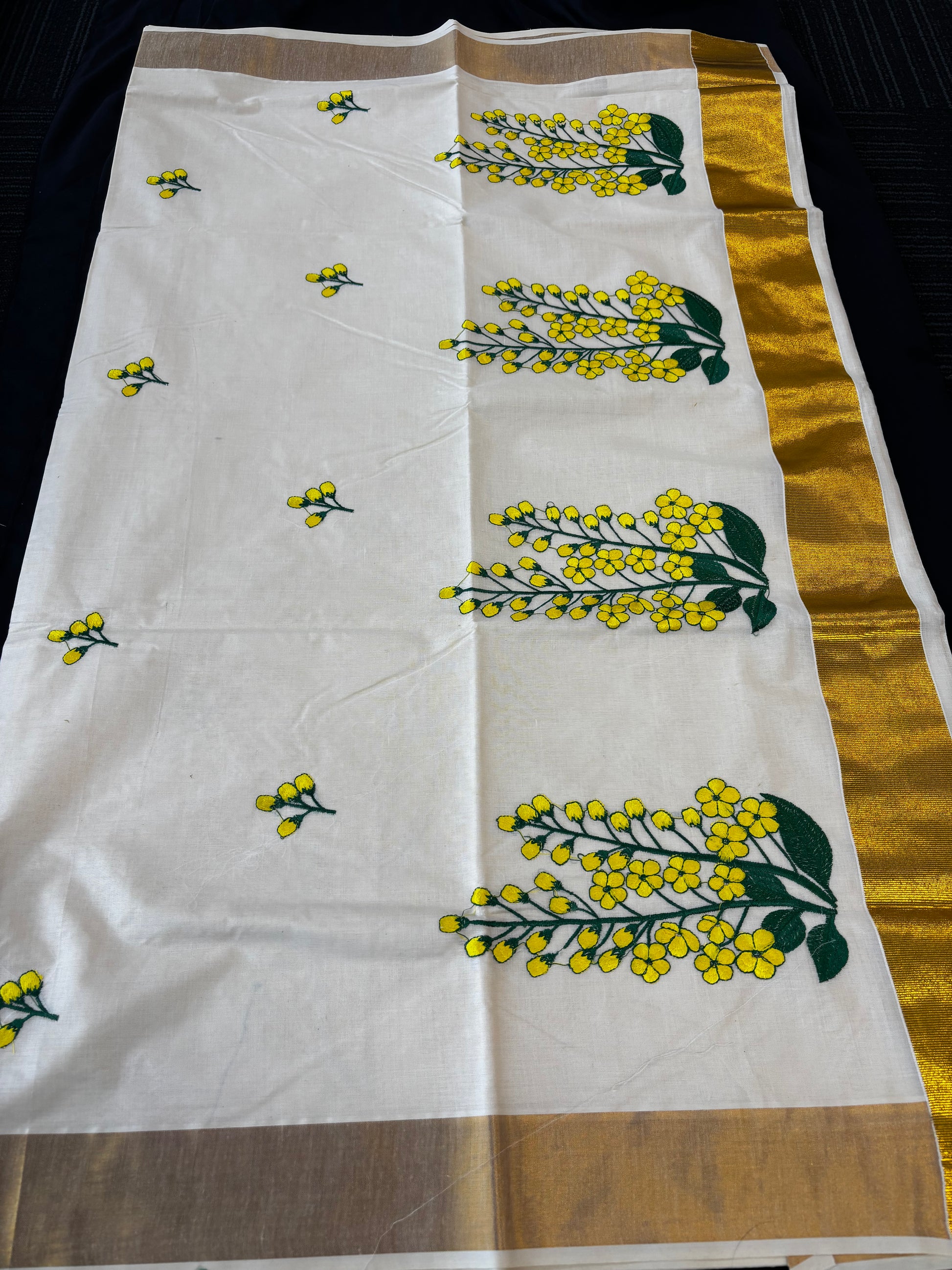 Kerala Kasavu saree with yellow floral embroidery and gold border – view 3