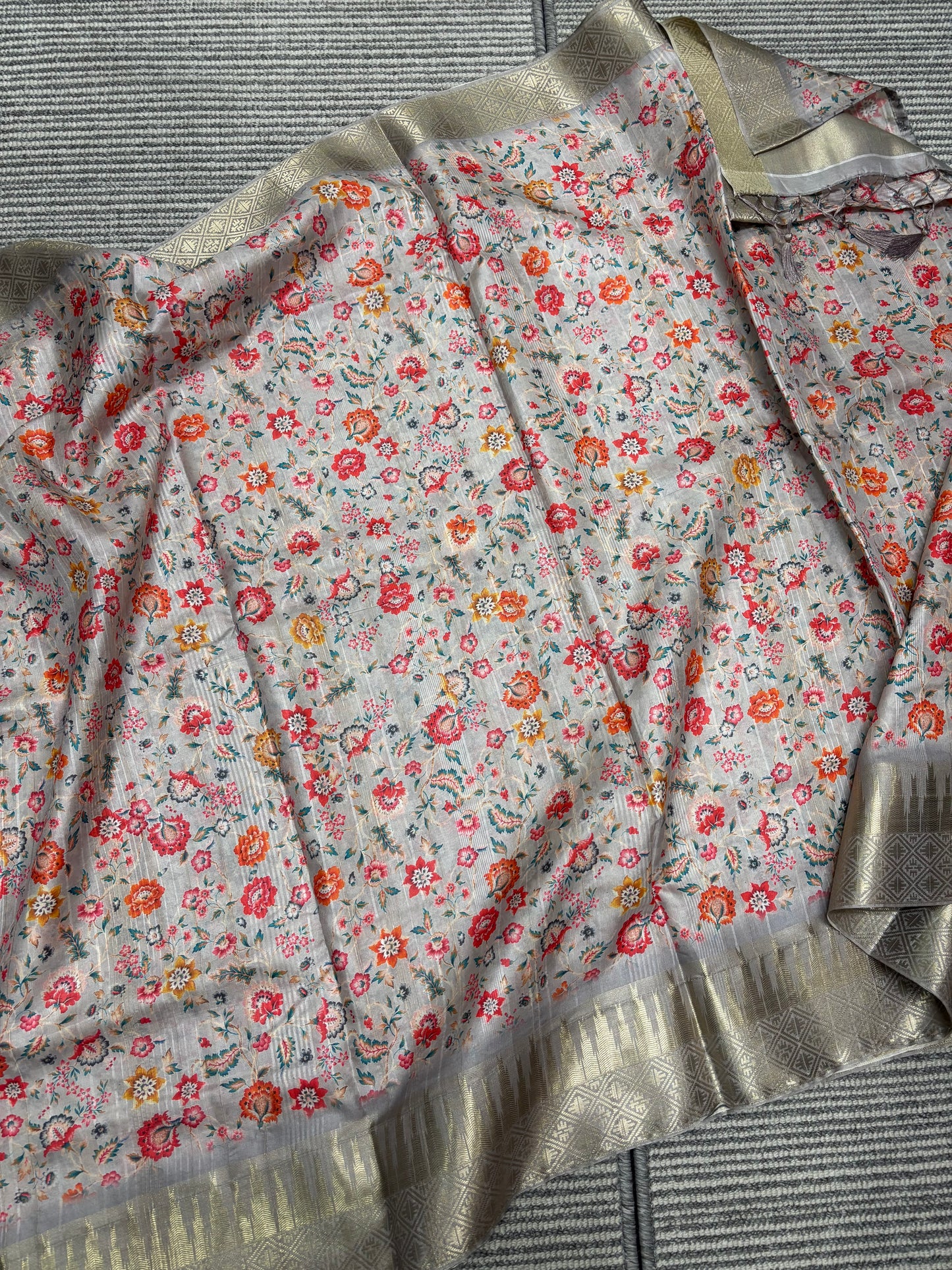 Elegant Light Grey Banarasi Tussar Saree Featuring Floral print and Golden Border