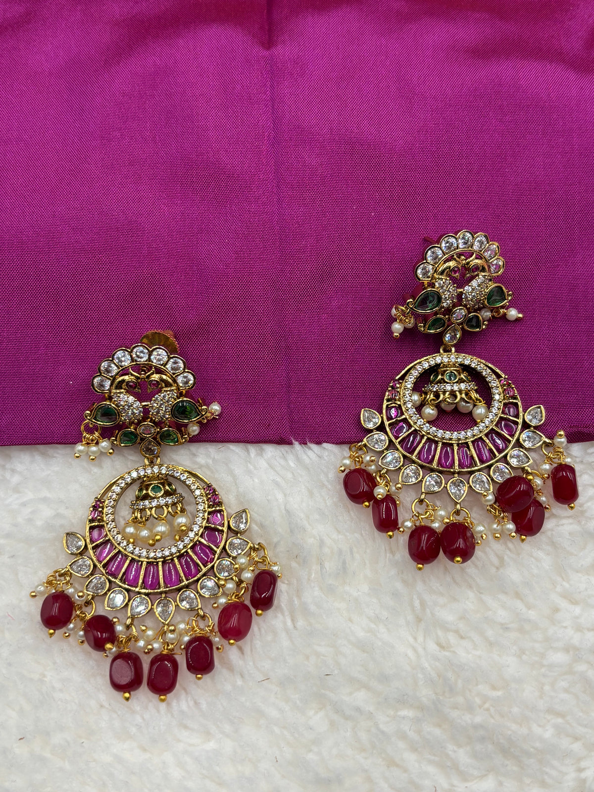 Premium Red Stone Chandbali Jhumka Earrings with Green & Pearl Detailing – Antique Gold Finish