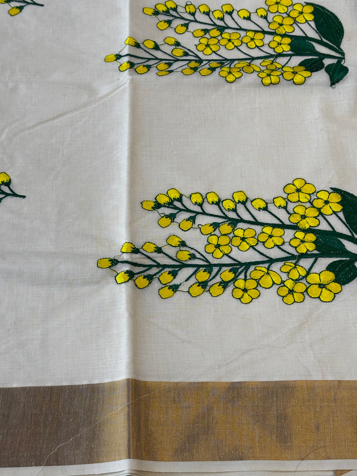 Kerala Kasavu saree with yellow floral embroidery and gold border – view 4