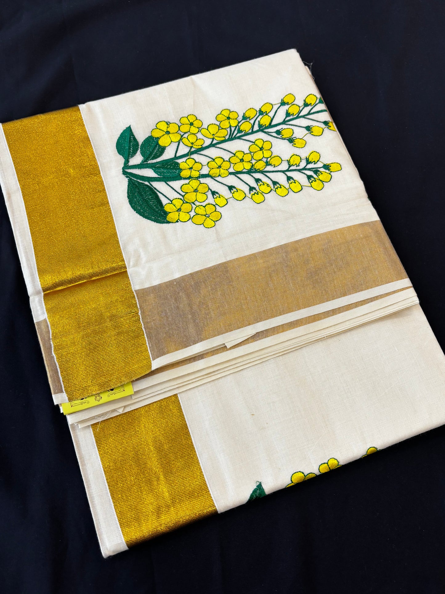 Kerala Kasavu saree with yellow floral embroidery and gold border – view 2