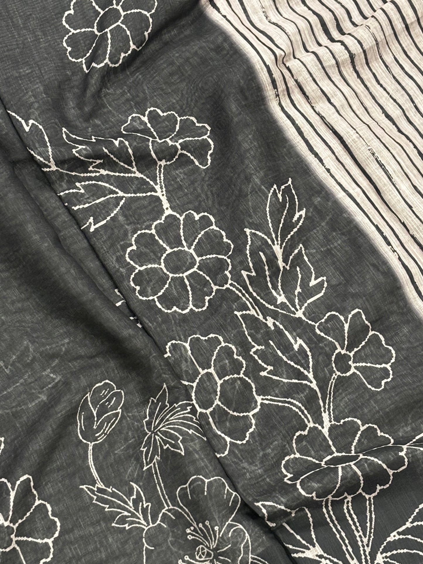Elegantly Crafted Black Linen Cotton Saree with Beige Floral Print, Golden Border, Tassels & Blouse Piece