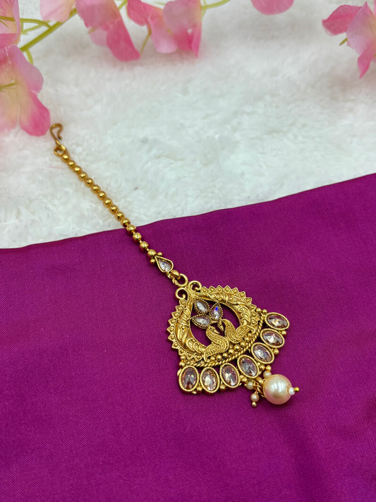 Antique Matte Gold Tikka – Peacock Motif with Crystal Stones