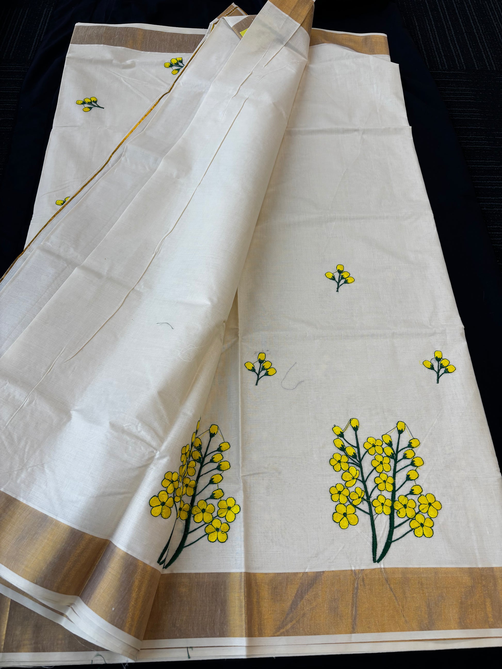 Kerala Kasavu saree with yellow floral embroidery and gold border – view 8