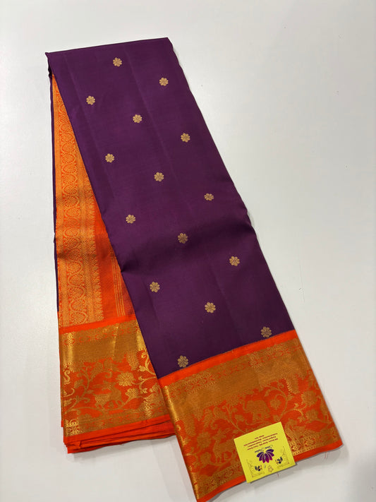 Elegant Purple Kanchipuram Silk Saree Featuring Orange Contrast and Floral Buttas