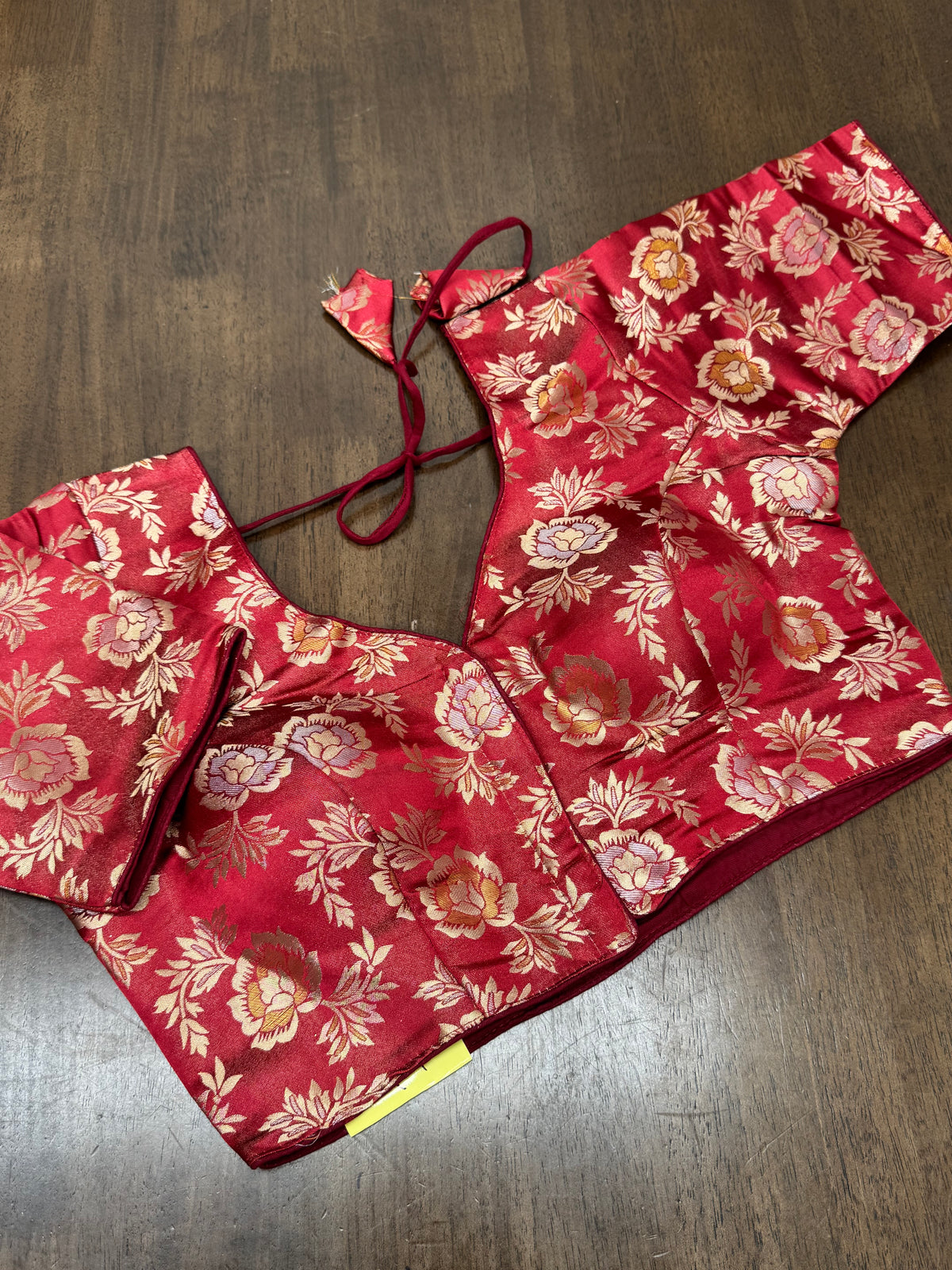 Deep maroon paired with gold‑woven florals creates a timeless blouse perfect for weddings, temple visits, and cultural celebrations.