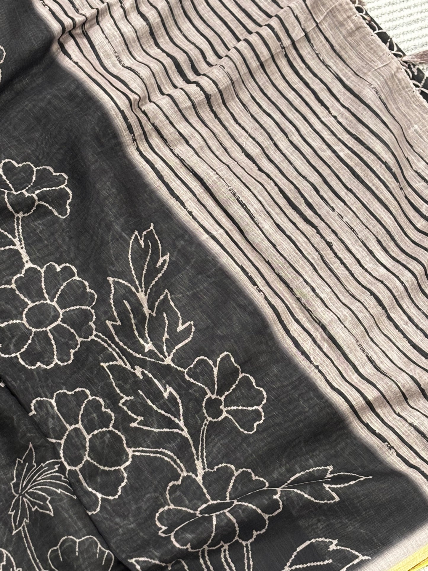Elegantly Crafted Black Linen Cotton Saree with Beige Floral Print, Golden Border, Tassels & Blouse Piece