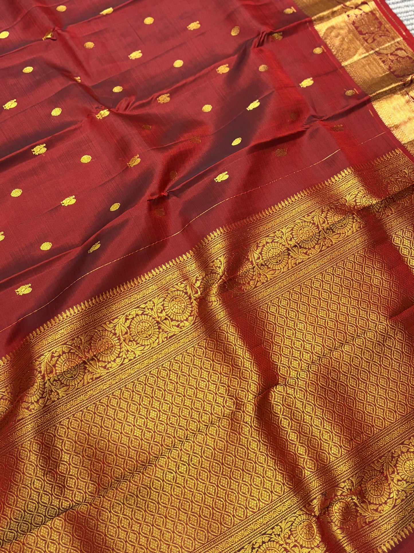 Elegant Maroon Pure Kanchipuram Silk Saree Featuring Traditional Peacock Buttas & Classic Zari Detailing