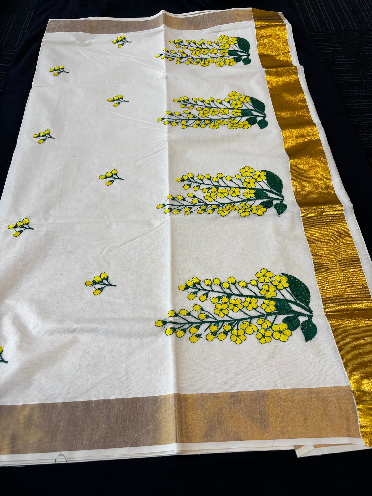 Kerala Kasavu saree with yellow floral embroidery and gold border – view 6