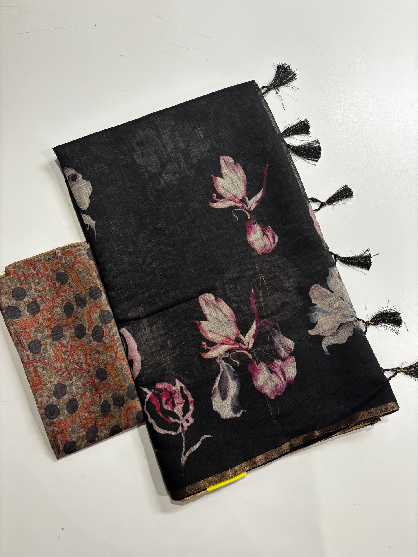 Beautifully Crafted Black Linen Cotton Saree with Floral Print, Golden Border, Tassels & Printed Blouse Piece | Shrees Fashion