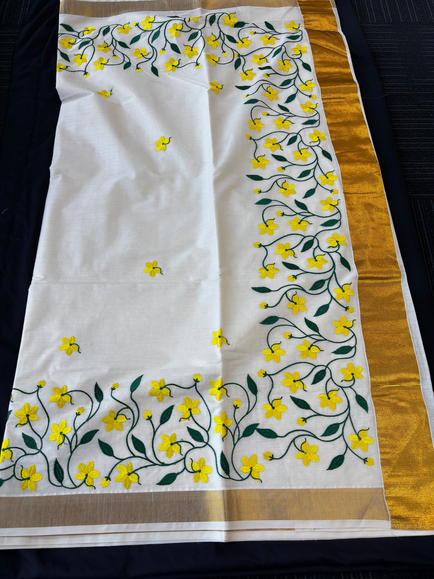 Kerala Kasavu saree with yellow floral and green vine embroidery – view 2