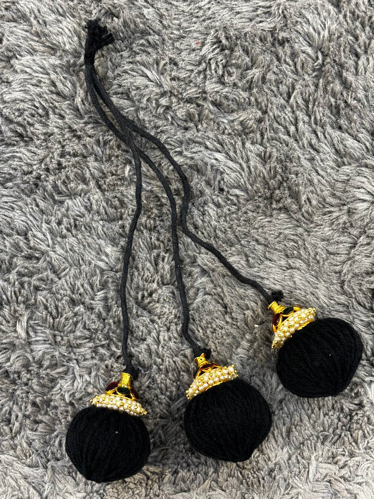 Traditional Kemp Stone Ball Kunjalam for Bharatanatyam braid styling.