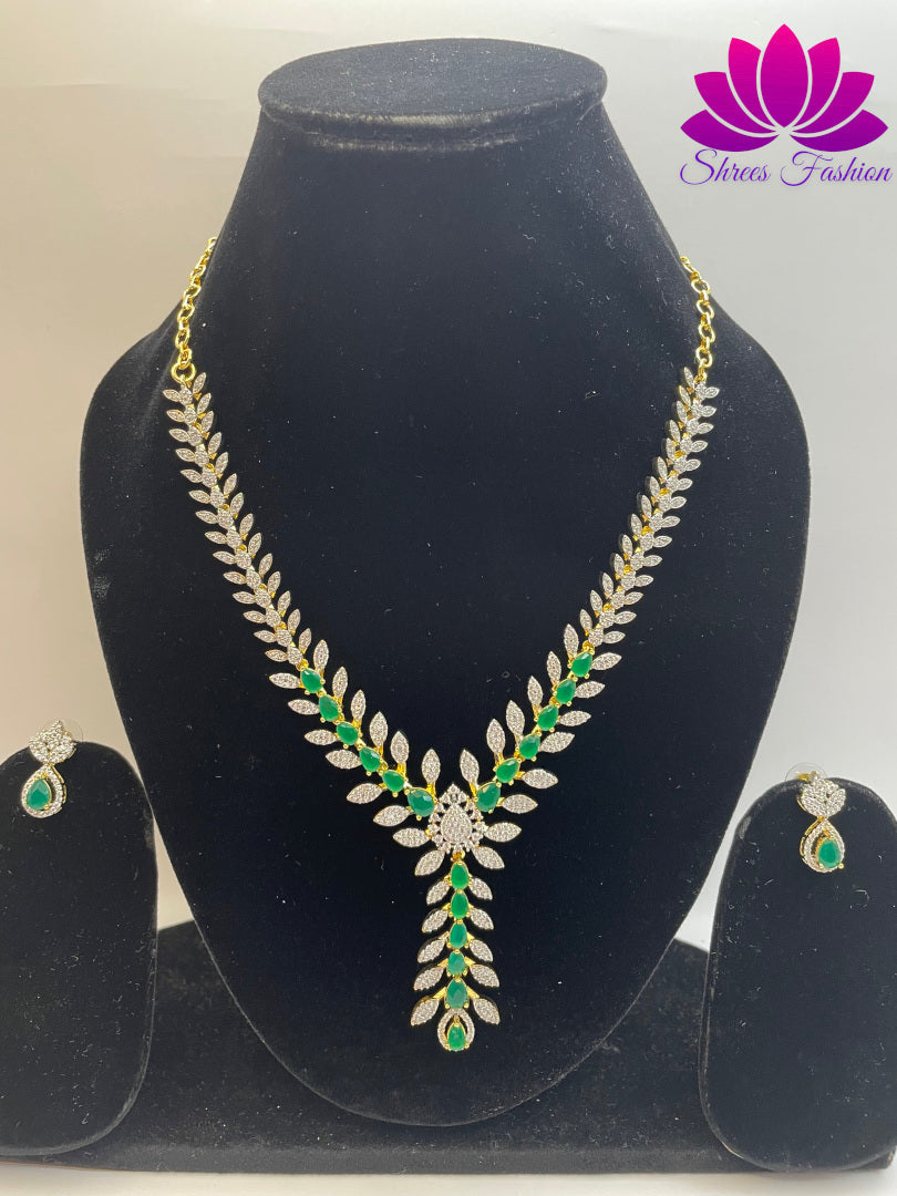 Gold-Plated Leaves Design Necklace with Green and White Stone Embellishments | Shrees Fashion