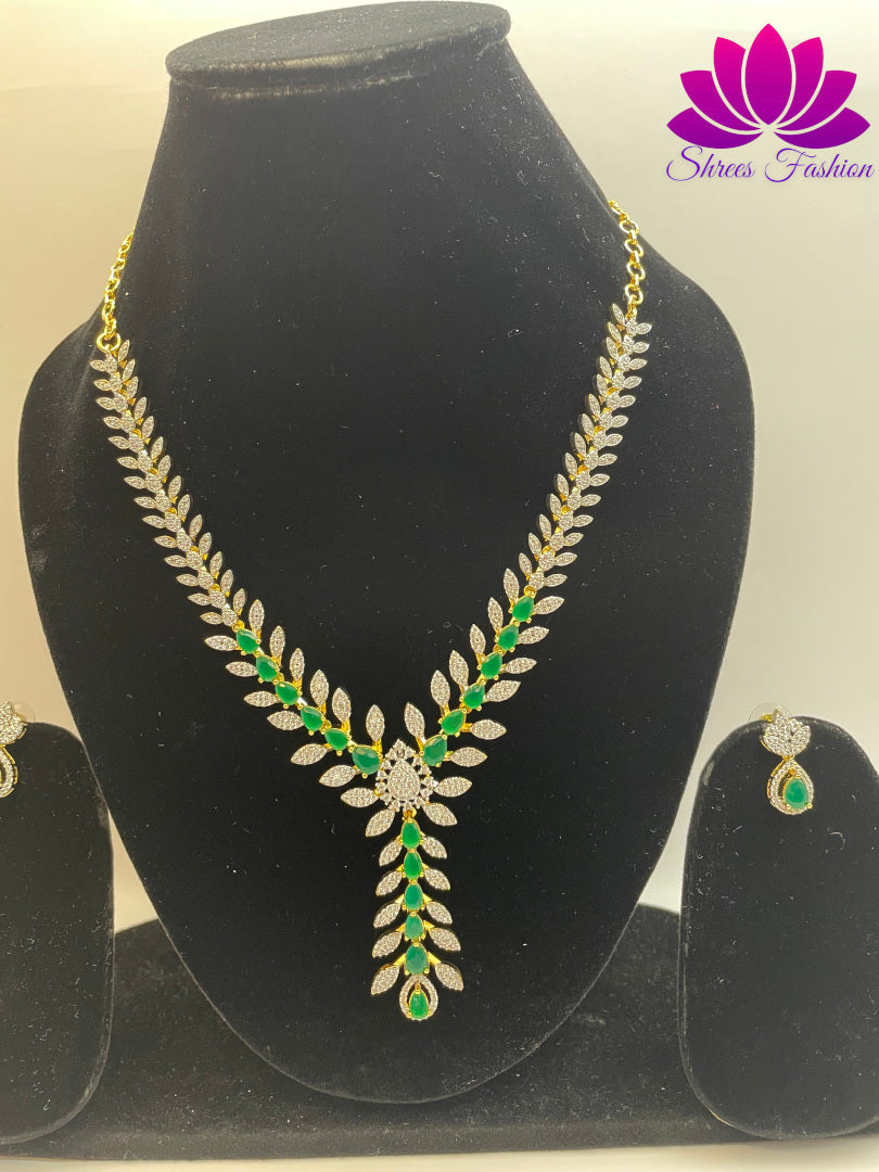 Gold-Plated Leaves Design Necklace with Green and White Stone Embellishments | Shrees Fashion